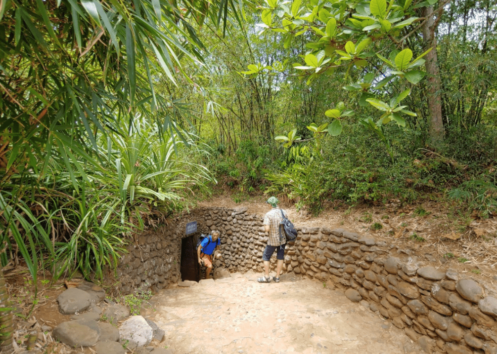 Travelers entering Vinh Moc Tunnels